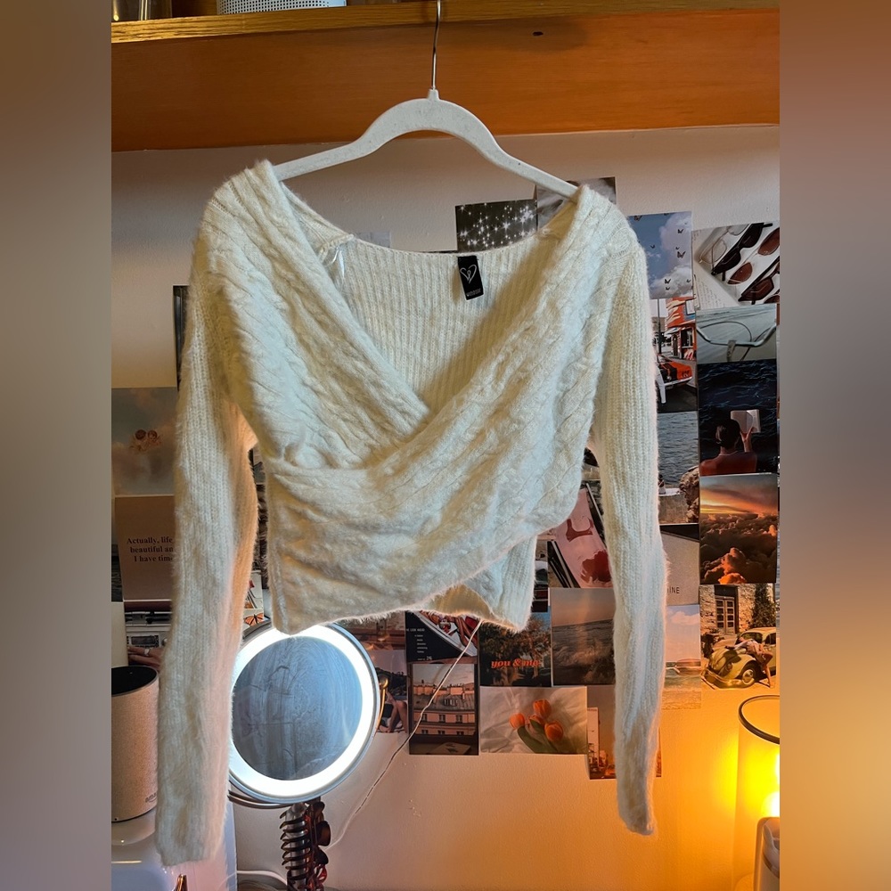 Cross sweater